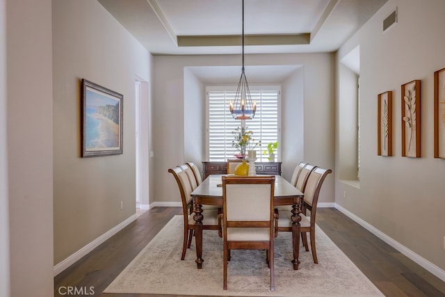 44 Water Lily Way, Coto De Caza, CA 92679 - dining area with a notable chandelier, dark wood-type flooring, visible vents, and a raised ceiling