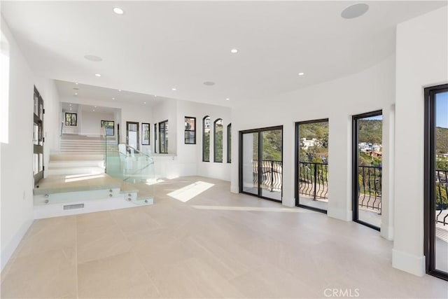 interior space with baseboards, recessed lighting, and visible vents