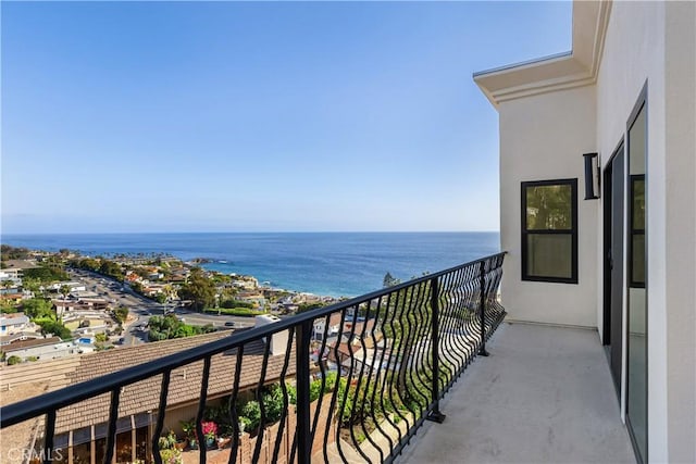 balcony featuring a water view
