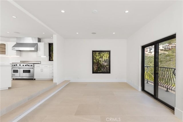 kitchen with range with two ovens, white cabinets, light countertops, and recessed lighting