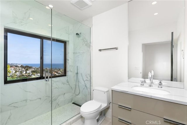 bathroom with visible vents, a marble finish shower, toilet, and vanity