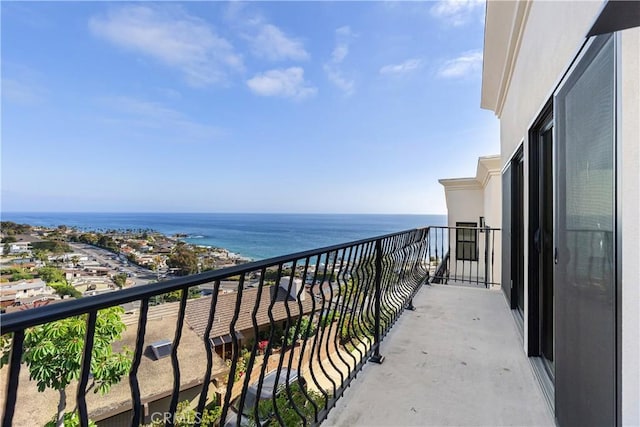 balcony featuring a water view