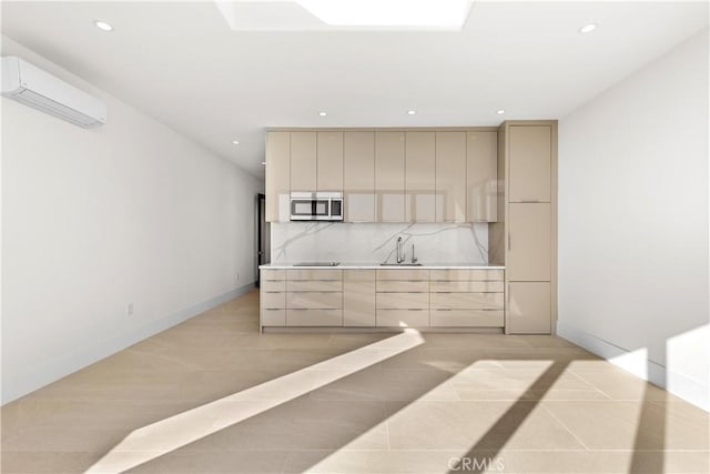 kitchen with recessed lighting, stainless steel microwave, light countertops, a wall mounted AC, and modern cabinets