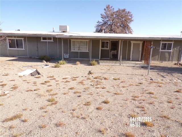 74813 Sunrise Dr Unit 29, Palms, CA 92277 - view of front of property with board and batten siding and a sunroom