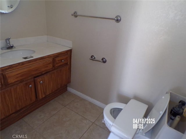 74813 Sunrise Dr Unit 29, Palms, CA 92277 - half bath featuring toilet, vanity, and tile patterned flooring