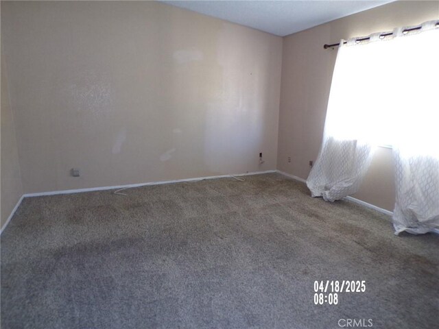74813 Sunrise Dr Unit 29, Palms, CA 92277 - carpeted empty room with baseboards
