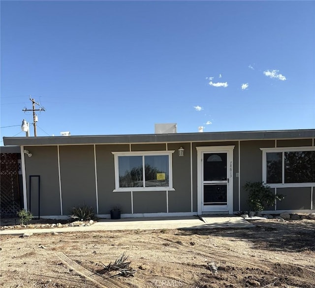 74813 Sunrise Dr Unit 29, Palms, CA 92277 - rear view of house featuring stucco siding