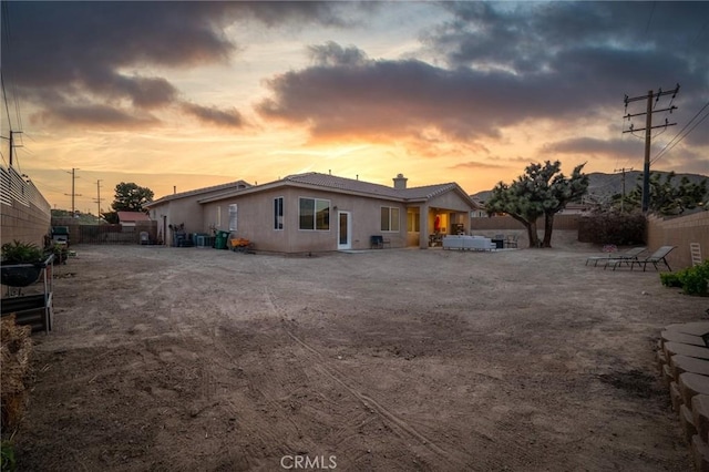 7625 Pinon Dr, Yucca Valley, CA 92284 - view of front of home with a chimney and stucco siding