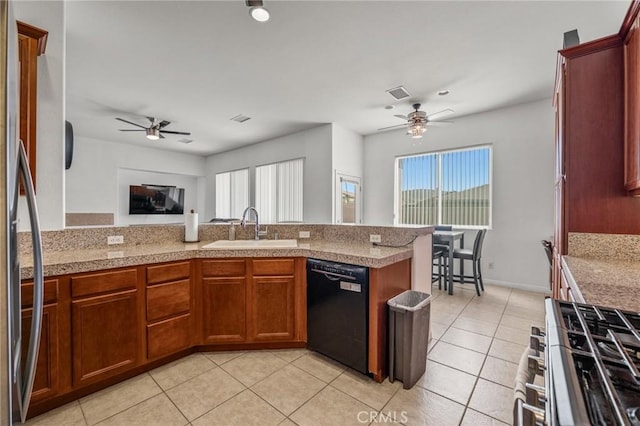 7625 Pinon Dr, Yucca Valley, CA 92284 - kitchen featuring ceiling fan, stainless steel appliances, light tile patterned flooring, and plenty of natural light