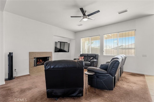 7625 Pinon Dr, Yucca Valley, CA 92284 - living room with ceiling fan, carpet, and a tile fireplace