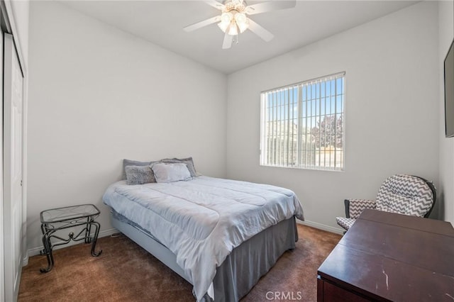 7625 Pinon Dr, Yucca Valley, CA 92284 - carpeted bedroom with baseboards and a ceiling fan