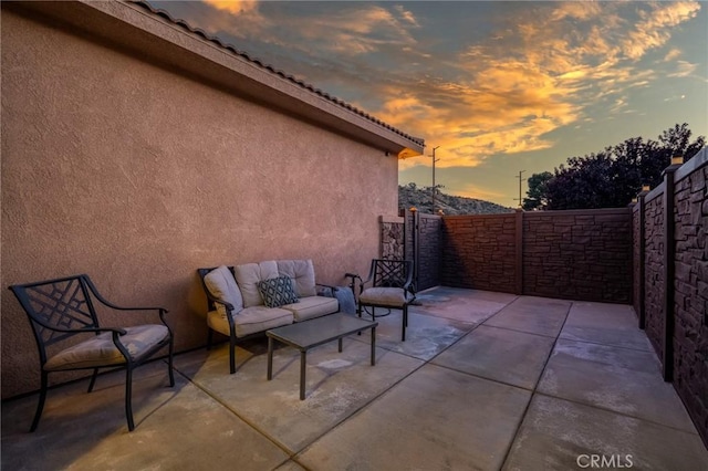 7625 Pinon Dr, Yucca Valley, CA 92284 - patio terrace at dusk with a patio and outdoor lounge area