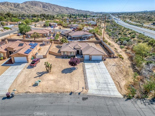 7625 Pinon Dr, Yucca Valley, CA 92284 - aerial perspective of suburban area featuring a mountainous background