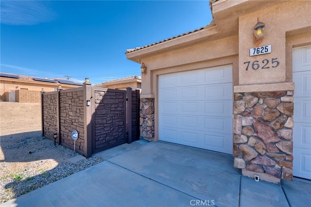 7625 Pinon Dr, Yucca Valley, CA 92284 - garage with a gate and driveway