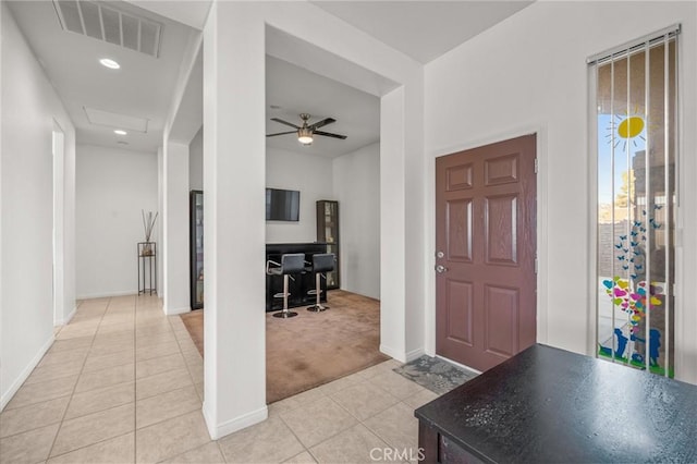 7625 Pinon Dr, Yucca Valley, CA 92284 - foyer entrance with light tile patterned flooring, light carpet, a ceiling fan, and recessed lighting