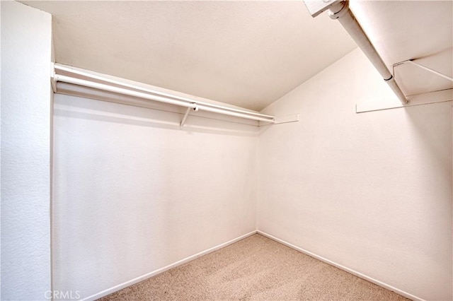 22911 Via Santiago, Mission Viejo, CA 92691 - spacious closet featuring vaulted ceiling and carpet floors