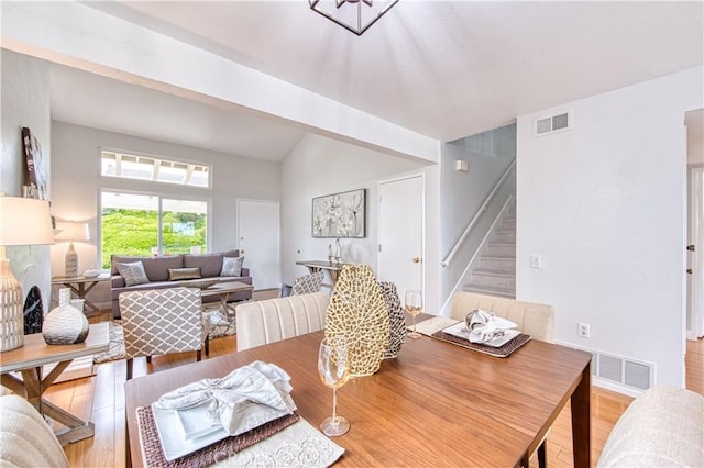 22911 Via Santiago, Mission Viejo, CA 92691 - dining room with visible vents, light wood-style floors, and stairs