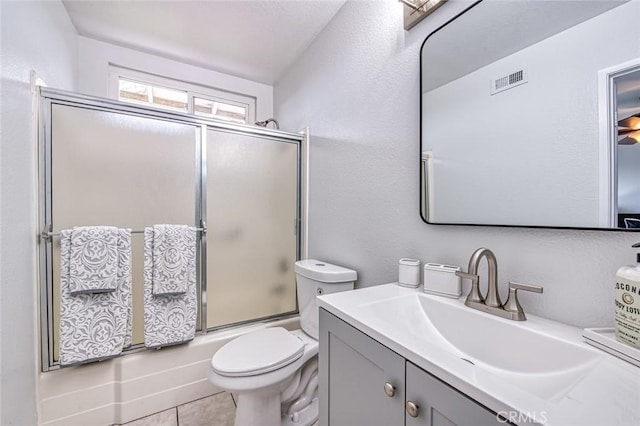 22911 Via Santiago, Mission Viejo, CA 92691 - bathroom featuring visible vents, enclosed tub / shower combo, toilet, vanity, and tile patterned flooring