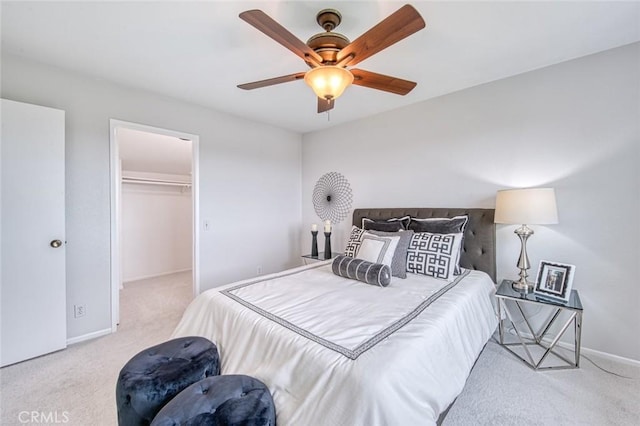 22911 Via Santiago, Mission Viejo, CA 92691 - carpeted bedroom featuring a ceiling fan, a walk in closet, a closet, and baseboards