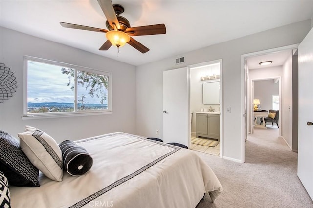 22911 Via Santiago, Mission Viejo, CA 92691 - bedroom with ensuite bath, light carpet, ceiling fan, a sink, and visible vents