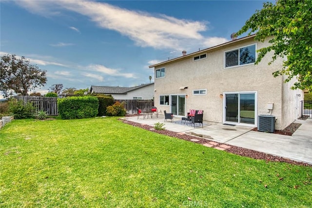 22911 Via Santiago, Mission Viejo, CA 92691 - back of property with central AC, a fenced backyard, stucco siding, and a patio area