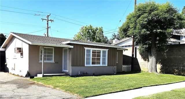 1060 Newhill St, Glendora, CA 91741 - view of front facade with board and batten siding, a front lawn, a wall unit AC, and roof with shingles