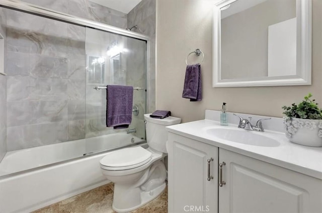 bathroom with enclosed tub / shower combo, toilet, and vanity