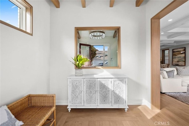 corridor with baseboards, a chandelier, beam ceiling, and recessed lighting