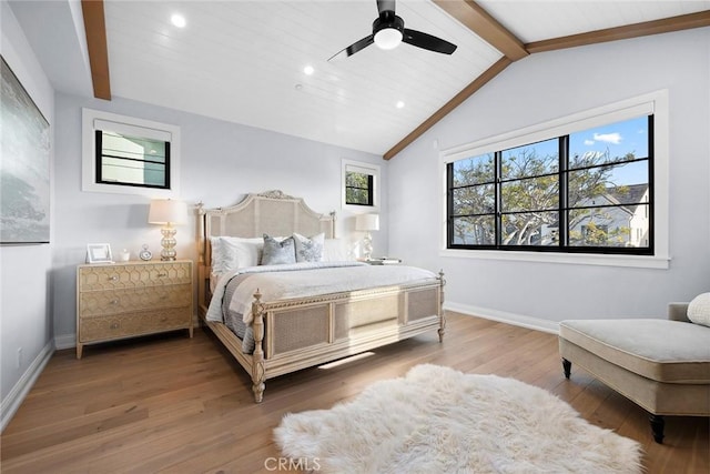 bedroom with vaulted ceiling with beams, wood finished floors, baseboards, and recessed lighting