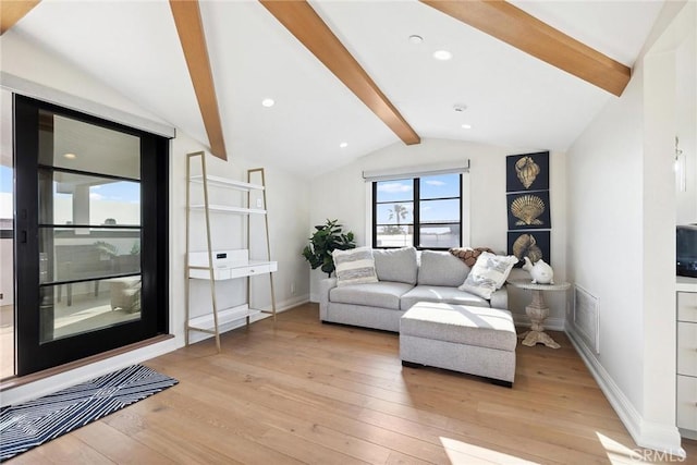 living room with light wood-type flooring, visible vents, baseboards, and lofted ceiling with beams
