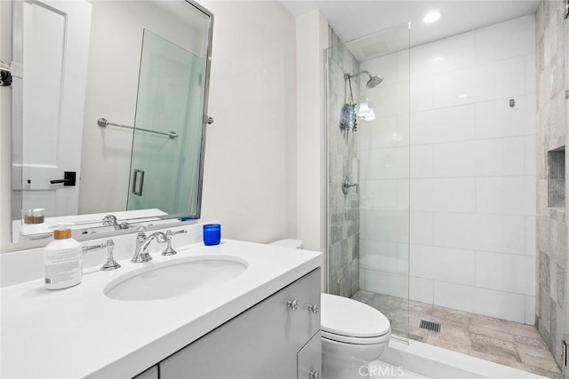 full bath with toilet, vanity, recessed lighting, and a stall shower