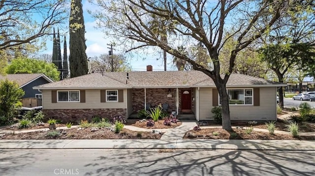 single story home with a chimney