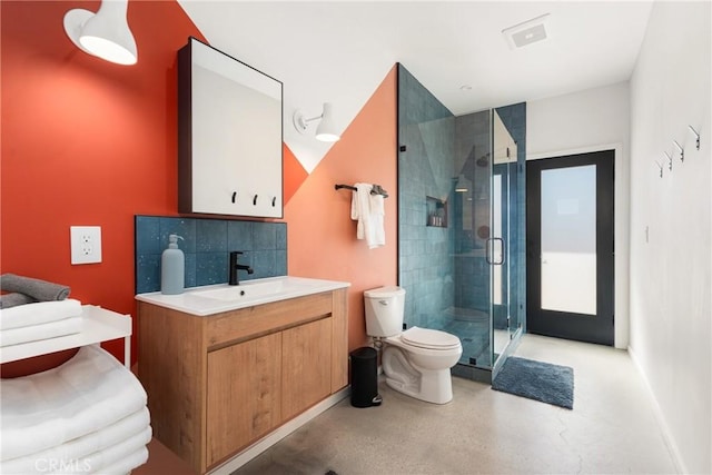 3170 Wesley Rd, Joshua Tree, CA 92252 - full bathroom with toilet, vanity, a stall shower, and backsplash