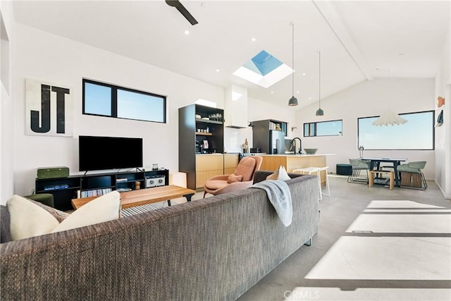 3170 Wesley Rd, Joshua Tree, CA 92252 - living area with a skylight, beam ceiling, finished concrete flooring, and high vaulted ceiling