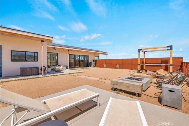 3170 Wesley Rd, Joshua Tree, CA 92252 - view of patio / terrace with a fire pit