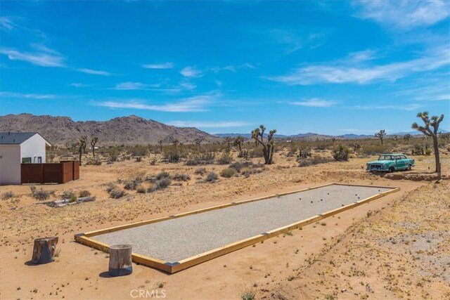 3170 Wesley Rd, Joshua Tree, CA 92252 - view of mountain backdrop with a desert landscape and rural landscape