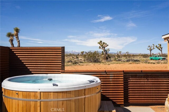3170 Wesley Rd, Joshua Tree, CA 92252 - view of patio / terrace with a hot tub and a mountain view