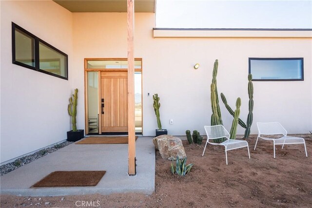 3170 Wesley Rd, Joshua Tree, CA 92252 - property entrance with stucco siding