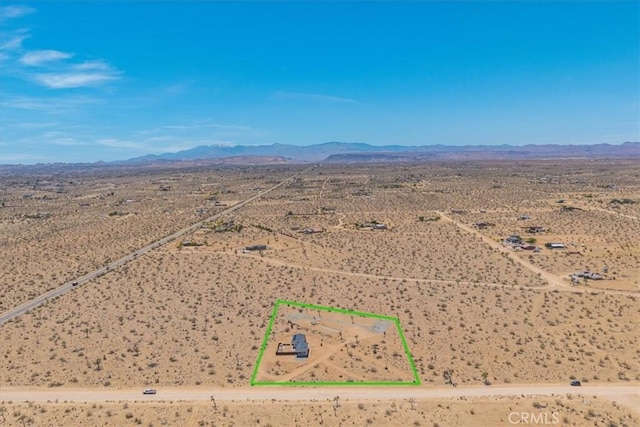 3170 Wesley Rd, Joshua Tree, CA 92252 - aerial view of sparsely populated area with a desert landscape, mountains, and property boundaries highlighted