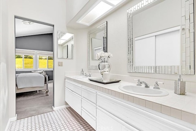 9 Gema, San Clemente, CA 92672 - full bath with double vanity, tile patterned floors, baseboards, and connected bathroom
