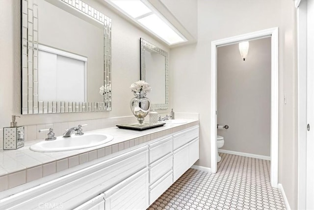 9 Gema, San Clemente, CA 92672 - full bathroom with toilet, baseboards, double vanity, and tile patterned floors