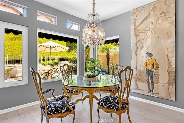 9 Gema, San Clemente, CA 92672 - dining room featuring a chandelier, light wood finished floors, and baseboards