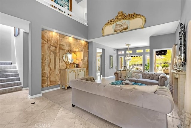 9 Gema, San Clemente, CA 92672 - living area featuring a chandelier, stairs, baseboards, and a high ceiling