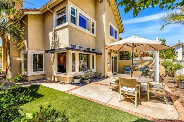 9 Gema, San Clemente, CA 92672 - rear view of house with stucco siding, a patio area, and fence