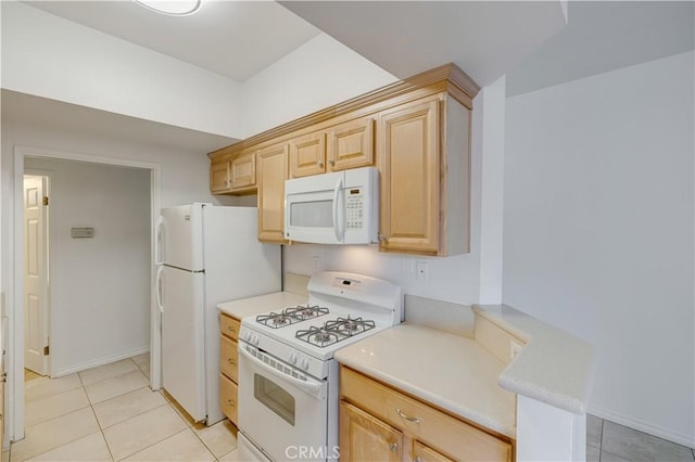 7211 Cozycroft Ave Unit 19, Winnetka, CA 91306 - kitchen with white appliances, light brown cabinetry, light tile patterned flooring, and light countertops