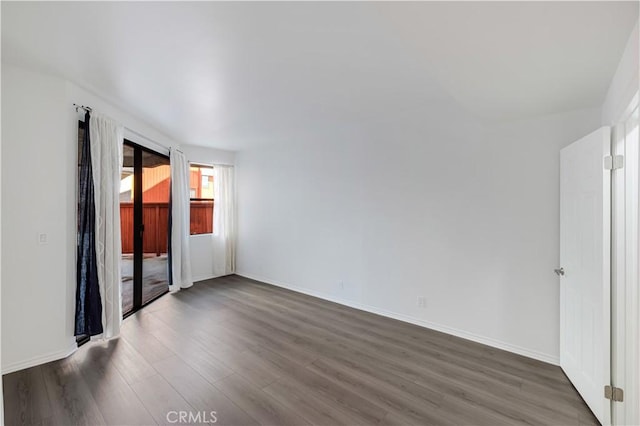 7211 Cozycroft Ave Unit 19, Winnetka, CA 91306 - spare room with dark wood-style flooring and baseboards