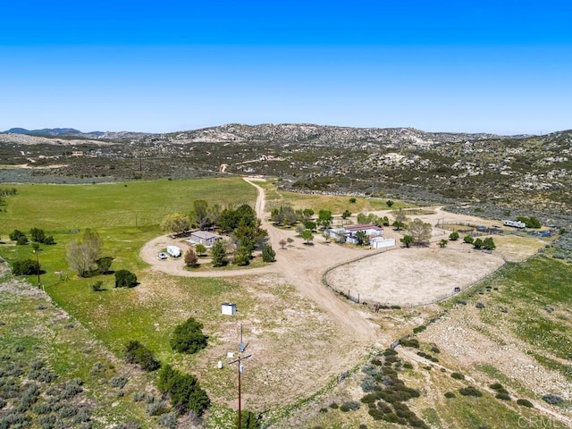 birds eye view of property with a rural view and a mountain view