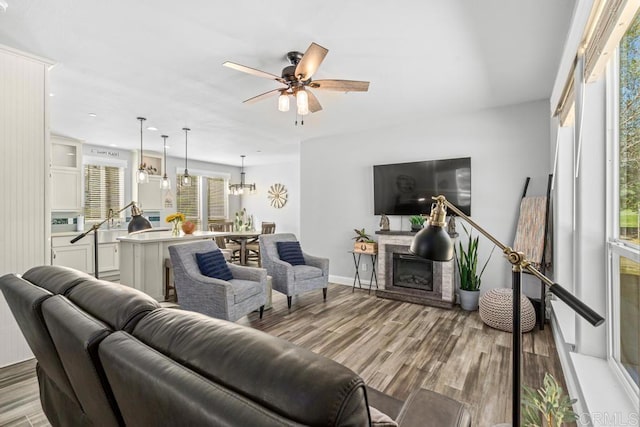 2815 Miller Valley Rd, Pine Valley, CA 91962 - living room featuring wood finished floors, a ceiling fan, a stone fireplace, baseboards, and recessed lighting