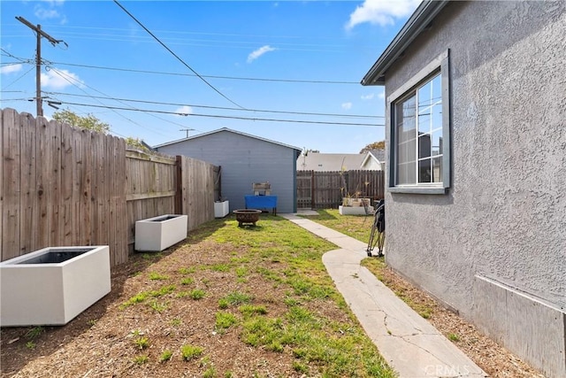 1515 S Walker Ave, San Pedro, CA 90731 - view of yard featuring a fenced backyard and a fire pit