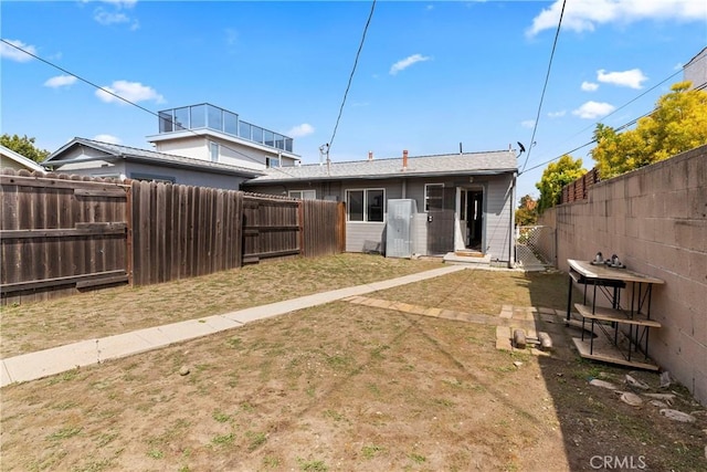 1515 S Walker Ave, San Pedro, CA 90731 - back of property featuring a yard, a gate, and a fenced backyard